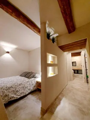 Letto o letti in una camera di Talismano Luxury Suite & Loft & Alcova & Maison
