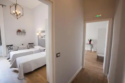 Letto o letti in una camera di Largo Donnaregina Home