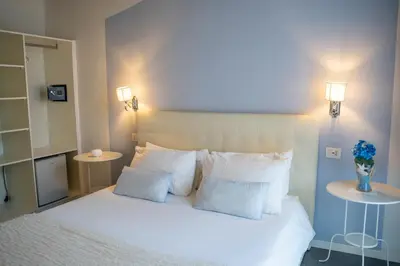 Letto o letti in una camera di Sotto le Stelle ai Decumani