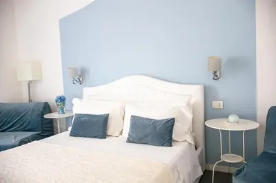 Letto o letti in una camera di Sotto le Stelle ai Decumani