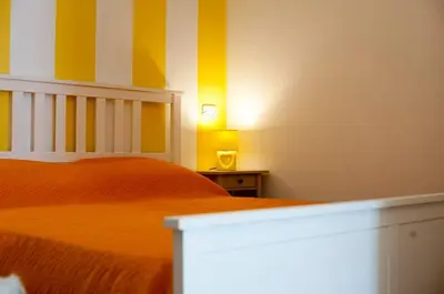 Letto o letti in una camera di O' Paese E Masaniello