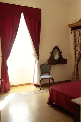 Letto o letti in una camera di WELL COME - Museo