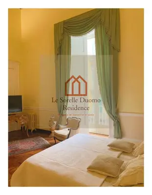 Letto o letti in una camera di Le Sorelle Duomo