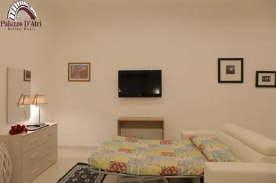 Letto o letti in una camera di Palazzo D'Atri