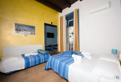 Letto o letti in una camera di Chiaia Relax