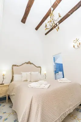 Letto o letti in una camera di NapulitanDream Duomo