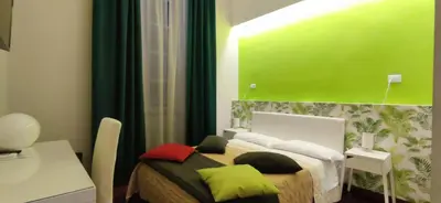 Letto o letti in una camera di B&B Rettifilo