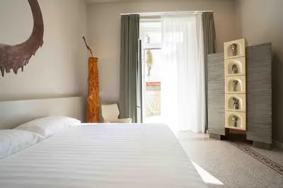 Letto o letti in una camera di Atelier Inès Arts & Suites