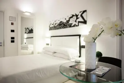 Letto o letti in una camera di LHP Suite Napoli Parco Margherita