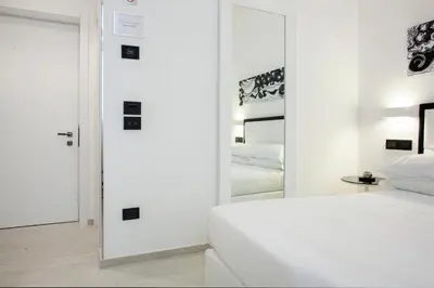 Letto o letti in una camera di LHP Suite Napoli Parco Margherita