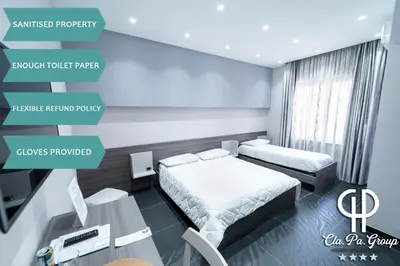 Letto o letti in una camera di Al Campanile H Napoli Centro, by ClaPa Group Dislocated Hospitality