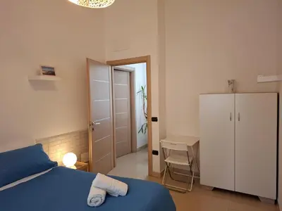 Letto o letti in una camera di Dimora Filangieri
