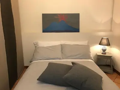 Letto o letti in una camera di Magione Serra , dimora partenopea