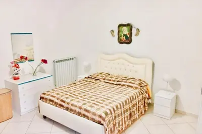 Letto o letti in una camera di Miseria e Nobiltà Apartment CHECK-IN FROM 12 00 TO 15 00