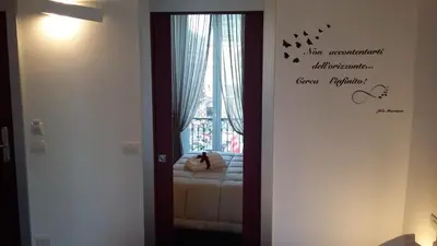 Letto o letti in una camera di Fourooms Museo Filangieri By Dimorra