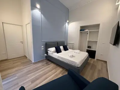 Letto o letti in una camera di Sun Art Naples Rooms