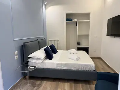 Letto o letti in una camera di Sun Art Naples Rooms