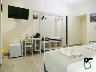 Letto o letti in una camera di Hotiday Spaccanapoli I Borbone