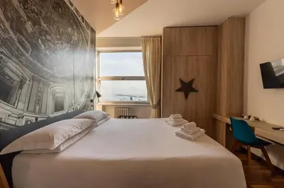 Letto o letti in una camera di De Gasperi 55