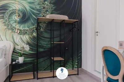Letto o letti in una camera di Palazzo Chiatamone