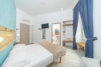 Letto o letti in una camera di B&B DolceVita Napoli