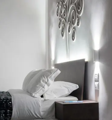 Letto o letti in una camera di Dada Suite