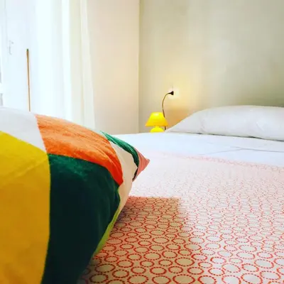 Letto o letti in una camera di Domus Alma