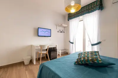 Letto o letti in una camera di Napolilive B&B