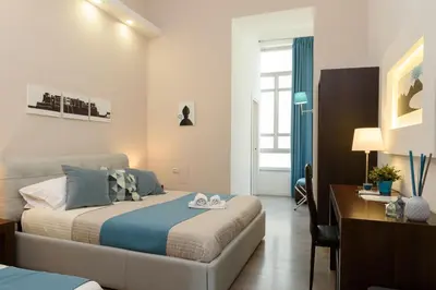 Letto o letti in una camera di Domus Angioina