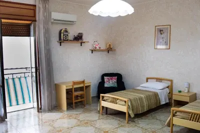 Letto o letti in una camera di La bella Napoli