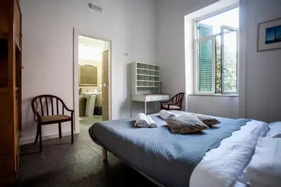 Letto o letti in una camera di La Controra Hostel Naples