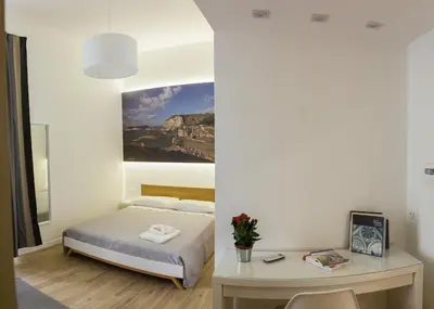 Letto o letti in una camera di Napolinn