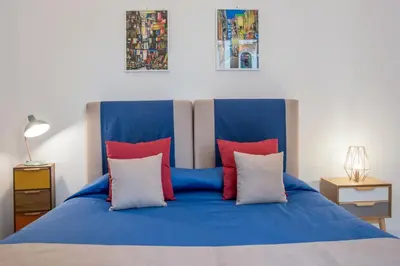Letto o letti in una camera di Napoliamo Guest House