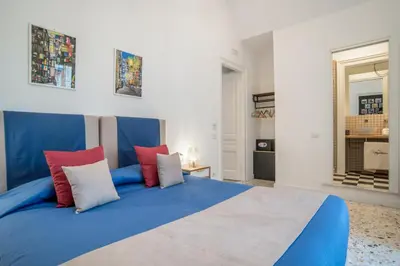 Letto o letti in una camera di Napoliamo Guest House
