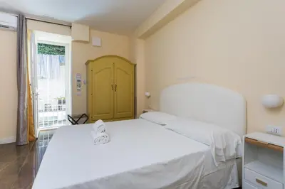 Letto o letti in una camera di Chiaia 205 By Dimorra