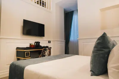 Letto o letti in una camera di Relais Piazza Vittoria