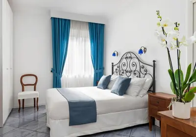Letto o letti in una camera di Fiorentini Residence NAPOLI