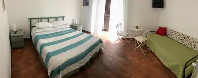 Letto o letti in una camera di Le Stanze di Dolly