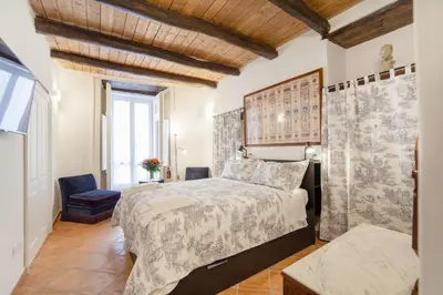 Letto o letti in una camera di Palazzo Marigliano