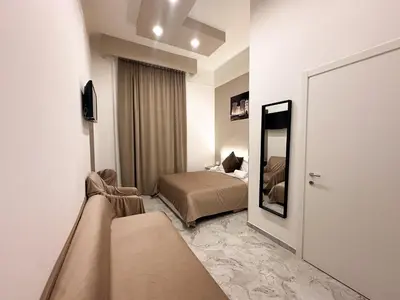 Letto o letti in una camera di Benvenuto a Napoli