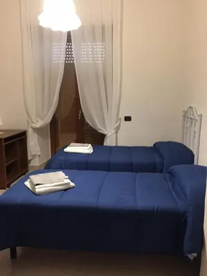Letto o letti in una camera di Il Cuore di Napoli