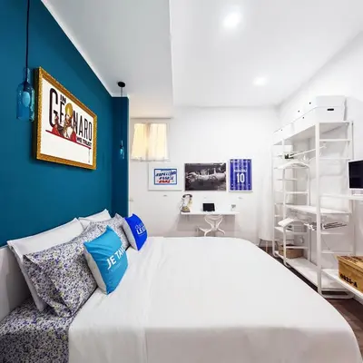 Letto o letti in una camera di Napulitano Assaje Home, arte e tradizione nel cuore del Centro Storico!