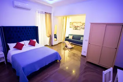 Letto o letti in una camera di Palazzo 15 Napoli