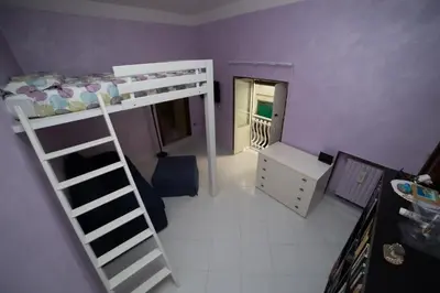 Letto o letti in una camera di Soggiorno Aria