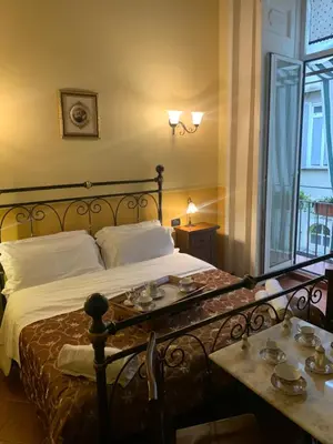 Letto o letti in una camera di Hotel PIGNATELLI Napoli