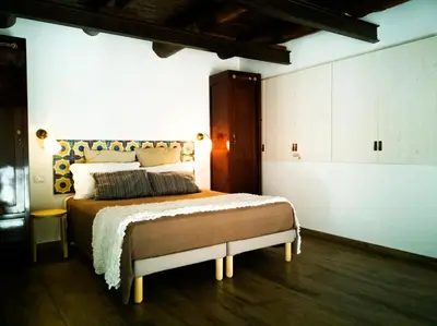 Letto o letti in una camera di casa vacanza il sole di Napoli