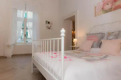 Letto o letti in una camera di Maison la Mitra - Dimore Partenopee
