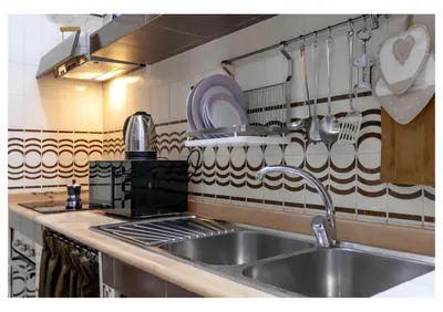 Cucina o angolo cottura di Niloufar residence Napoli