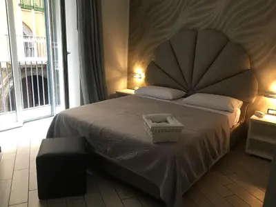Letto o letti in una camera di B&B Fiumara