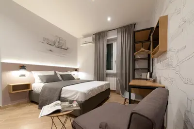 Letto o letti in una camera di Eco di Napoli